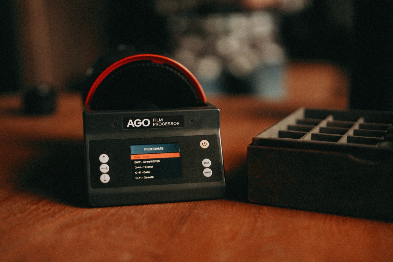The AGO Film Processor on a wooden desk